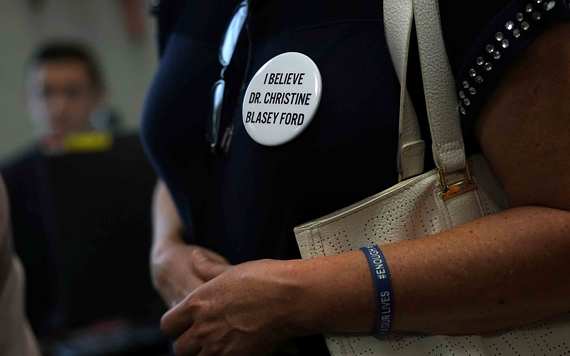 An activists wears a button in support of Christine Blasey Ford, who has accused Supreme Court nominee Judge Brett Kavanaugh of sexual assault at a high school party about 35 years ago. Image: Alex Wong/Getty.