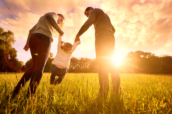 iStock Image. Family outside