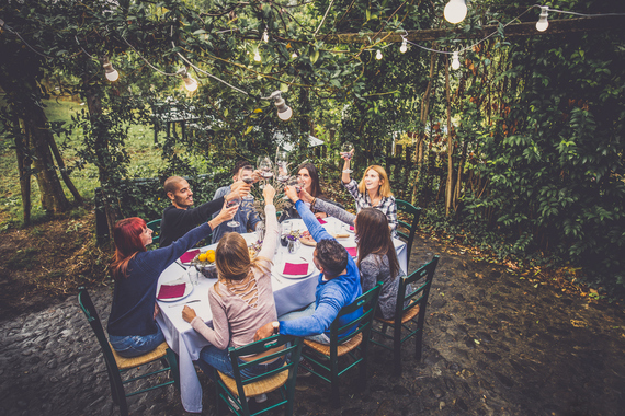 iStock Image. Family outside dinner.