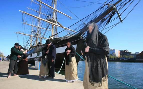 Academics and friends of the Irish perform a reenactment of the docking of an Irish Famine ship in Dublin.