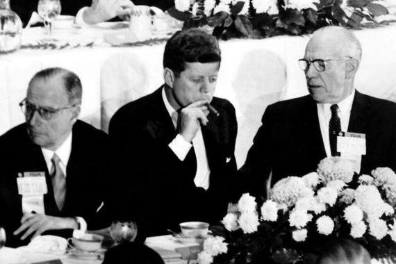 President John F. Kennedy smoking a cigar. (Getty Images)