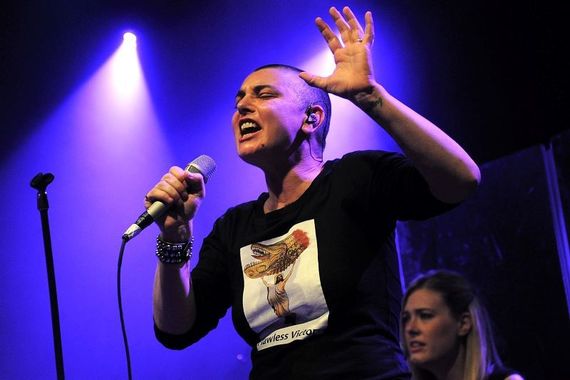 Sinead O'Connor on stage.