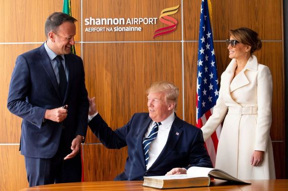 Leo Varadkar, Donald Trump and First Lady Melanie, as the President signs the visitor's book at Shannon Airport.