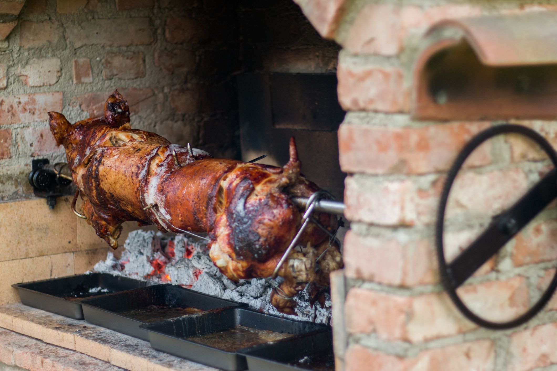 Nobody could roast pig like my Dad. Image: Getty.