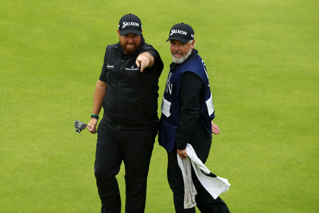 Open Champion Shane Lowry of Ireland celebrates with caddie Bo Martin on the 18th green during the final round of the 148th Open Championship held on the Dunluce Links at Royal Portrush Golf Club on July 21, 2019 in Portrush, United Kingdom. (Photo by Francois Nel/Getty Images)