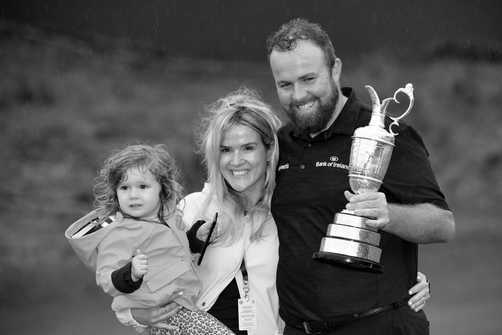 Open Champion Shane Lowry of Ireland celebrates with the Claret Jug, wife Wendy and daughter Iris on the 18th green during the final round of the 148th Open Championship held on the Dunluce Links at Royal Portrush Golf Club on July 21, 2019 in Portrush, United Kingdom. (Photo by Stuart Franklin/Getty Images)