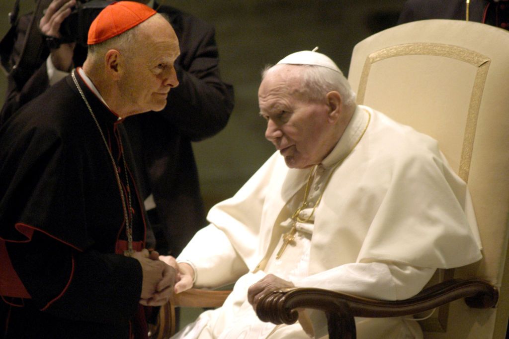Pope John Paul II (R) greets Washington's Archbishop Cardinal Theodore Edgar McCarrick at the Pope's weekly general audience January 15, 2003, in Vatican City, Italy. (Photo by Franco Origlia/Getty Images)