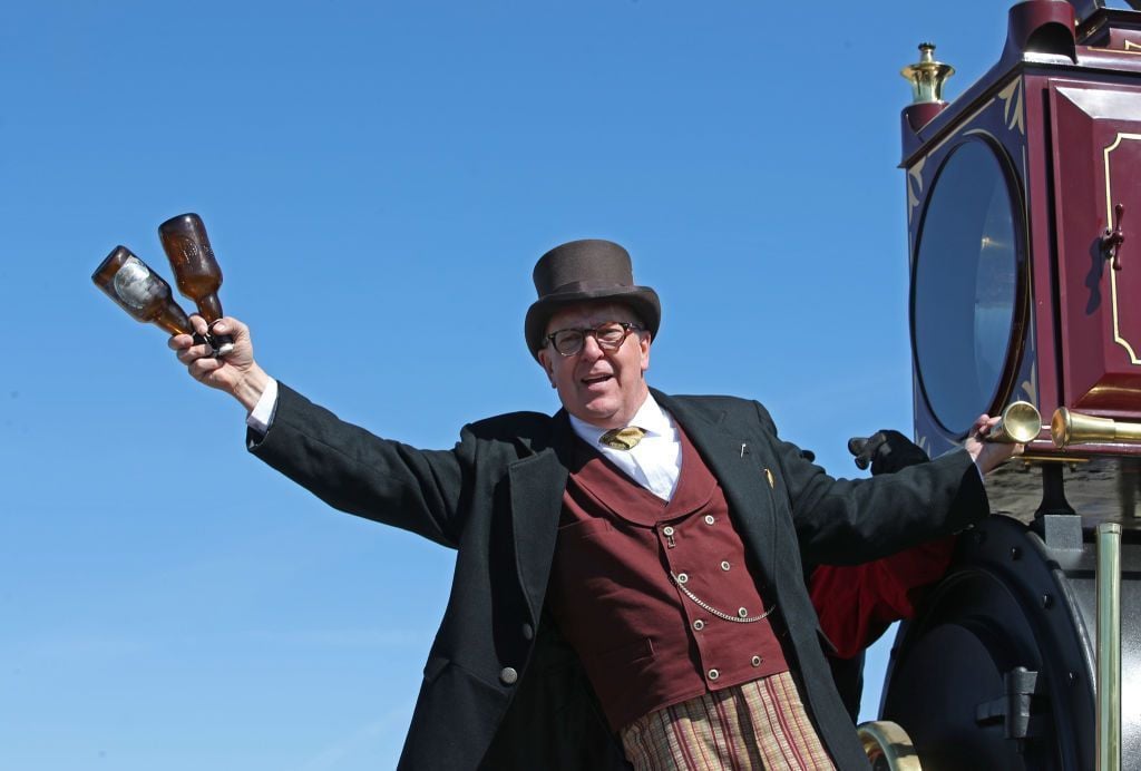 A man reenacts the historic Champagne Toast from the 119 steam engine for the 150th anniversary of the driving of the Golden Spike on May 10, 2019, in Promontory, Utah. The driving of the Golden Spike completed the Transcontinental Railroad that liked both coasts of the United States for the first time
