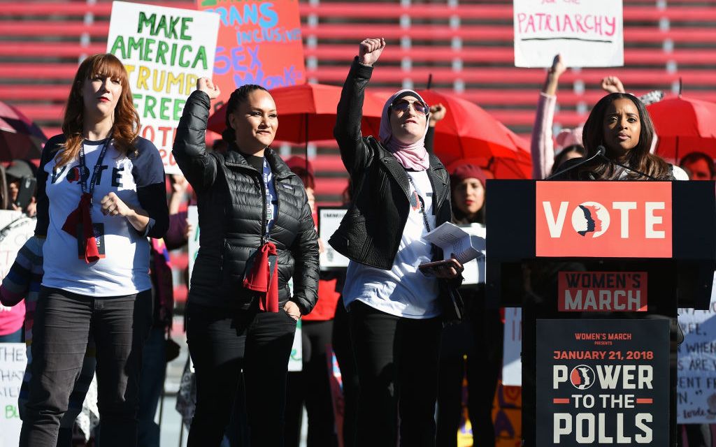 Women's March Co-Chairwomen Bob Bland, Carmen Perez, Linda Sarsour and Tamika D. Mallory speak during the Women's March 'Power to the Polls' voter registration tour launch at Sam Boyd Stadium on January 21, 2018 in Las Vegas, Nevada. Image credit: Ethan Miller/Getty.